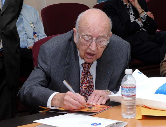 NASA's 50th Anniversay year. Panel discussion with four of NASA AMES's past center directors on how their tenure effected Ames and NASA. On the  projects they pushed for and/or pushed forward and the culture of the center and the agency and  how that worked for or against Ames, as well as major contributions of the time made by Ames Research Center.  Panel L-R; Hans Mark, Sy Syvertson, Dale Compton, Scott Hubbard and Pete Worden, present director. (Past Directors served for periods from 1969 thru 2006) Sy Syvertson signing a Time Magazine cover with a story about NASA's Mission to Mars. for a Space fan from Flordia.