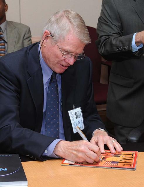NASA's 50th Anniversay year. Panel discussion with four of NASA AMES's past center directors on how their tenure effected Ames and NASA. On the  projects they pushed for and/or pushed forward and the culture of the center and the agency and  how that worked for or against Ames, as well as major contributions of the time made by Ames Research Center.  Panel L-R; Hans Mark, Sy Syvertson, Dale Compton, Scott Hubbard and Pete Worden, present director. (Past Directors served for periods from 1969 thru 2006)  Dale Compton signing a Time Magazine cover with a story about NASA's Mission to Mars. for a Space fan from Flordia.