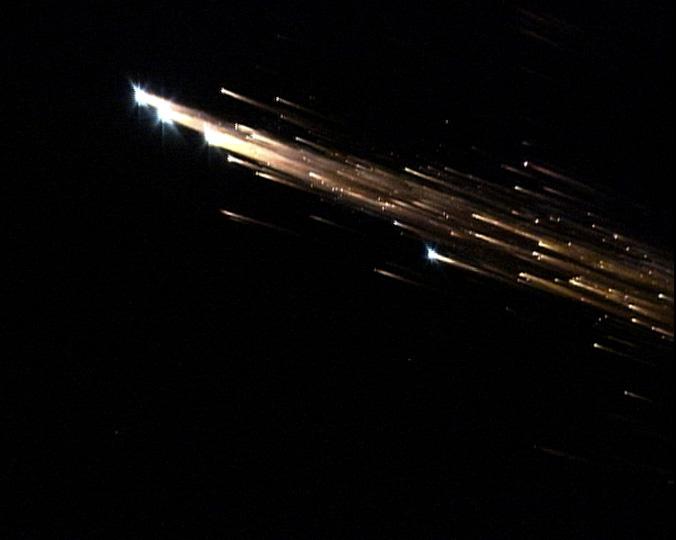 European Space Agency's 'Jules Verne' Automated Transfer Vehicle ATV-1 re-entry in Earth's atmosphere over Pacific Ocean.  The breakup ad fragmentation of the ESA's ATV-1 was captured in dramatic fashion by scientists aboard NASA's DC-8 airborne laboratory and a Gulfstream V aircraft as it re-entered the atmosphere early Monday morning over the South Pacific.  Photo Credit: NASA Ames Research Center/ESA/Jesse Carpenter/Bill Moede