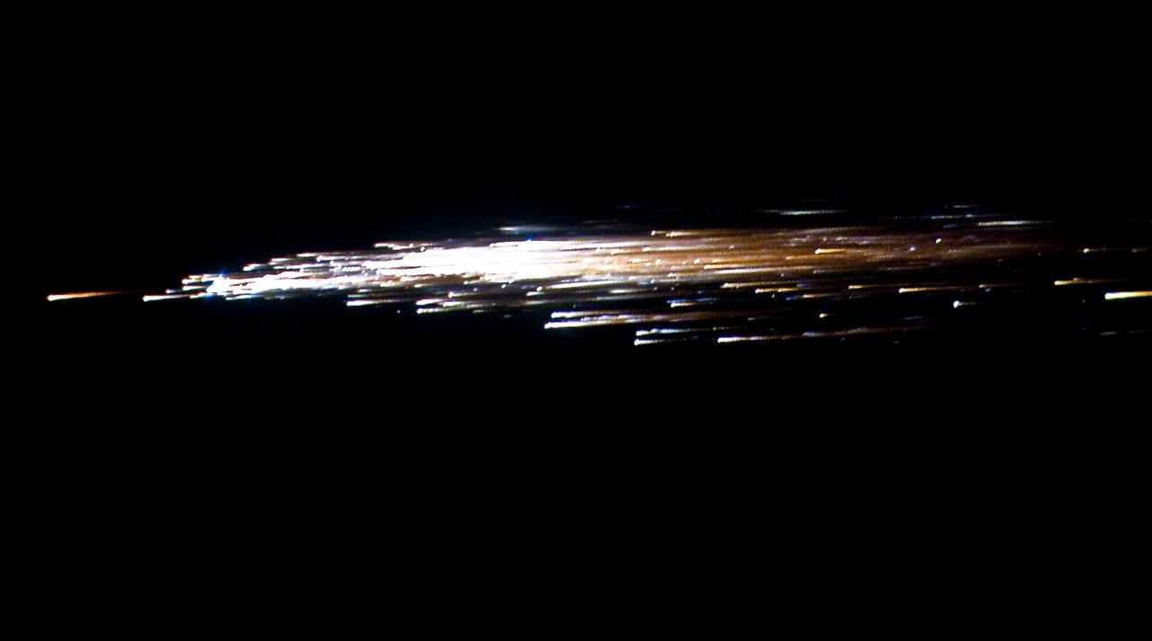 European Space Agency's 'Jules Verne' Automated Transfer Vehicle ATV-1 re-entry in Earth's atmosphere over Pacific Ocean.  The breakup ad fragmentation of the ESA's ATV-1 was captured in dramatic fashion by scientists aboard NASA's DC-8 airborne laboratory and a Gulfstream V aircraft as it re-entered the atmosphere early Monday morning over the South Pacific.  Photo Credit: NASA Ames Research Center/ESA/Jesse Carpenter/Bill Moede