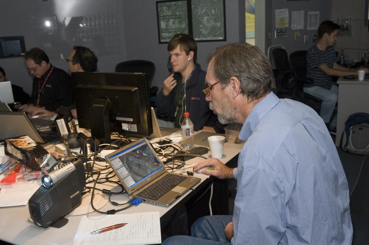 K-10 (red) plaentary rover at Marscape (Ames Mars Yard): with prototype flight control team remotely operating K-10 'Red' from  Ames Future Flight Centeral (FFC) Simulator. L-R; Jeff Tripp, David Lees, Trey Smith, Mark Helper, Simon Rutishauser