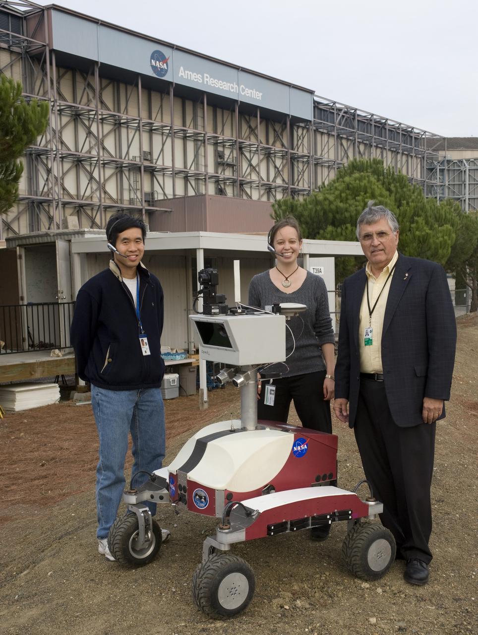 K-10 (red) robot operations tests at Marscape (Ames Mars Yard) with remote operations from Ames Future Flight Centeral (FFC) Simulator, L-R; Terry Fong, Melissa Rice and Harrison 'Jack' Schmitt (Apollo 17 Astronaut).