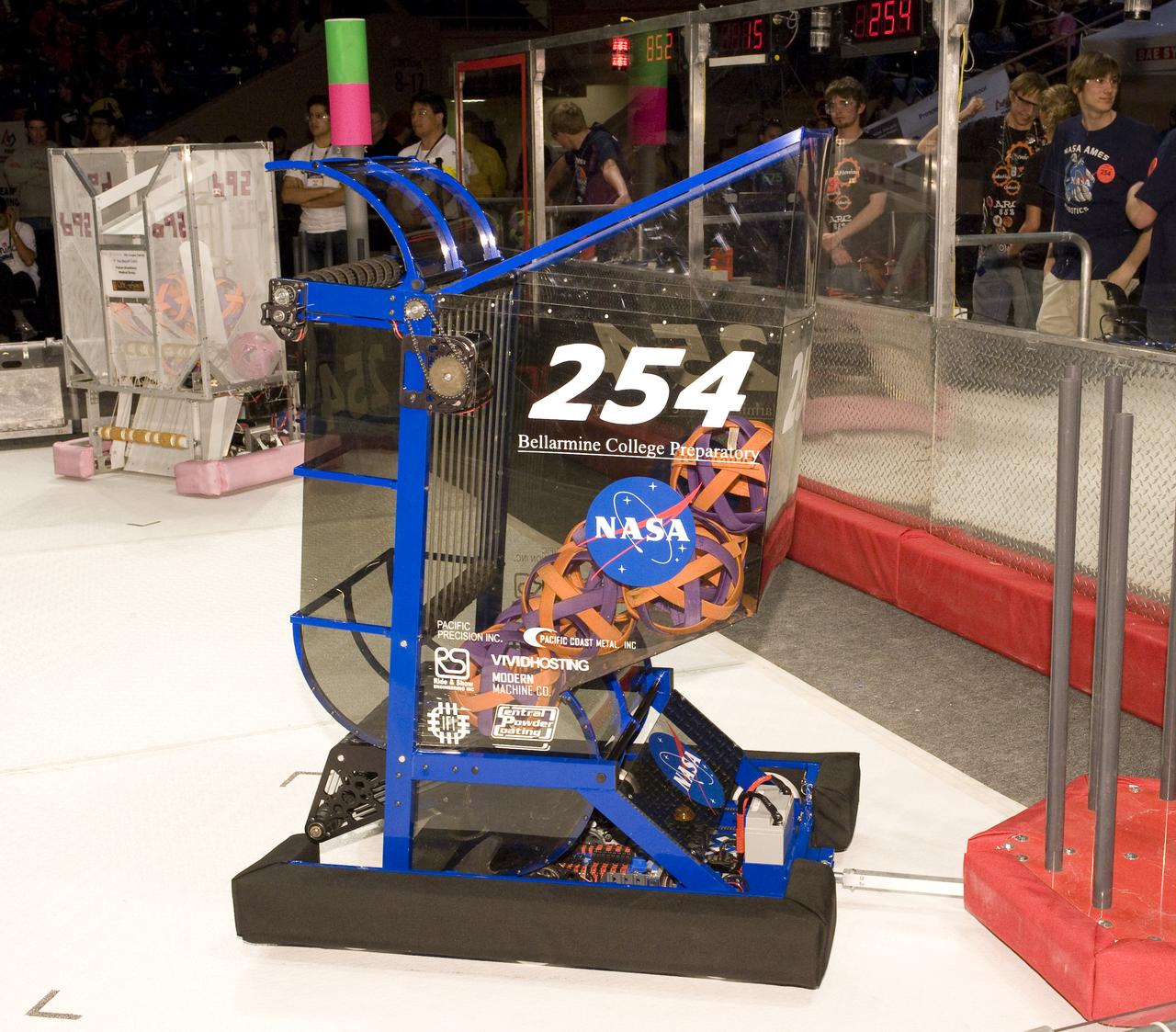 FIRST Robotics Competition  'Lunacy'  hosted by NASA at San Jose State University Event Center. For Inspiration and Recognition of Science and Technology let the games begin. NASA Cheesy Poofs team #254 robot on the floor.