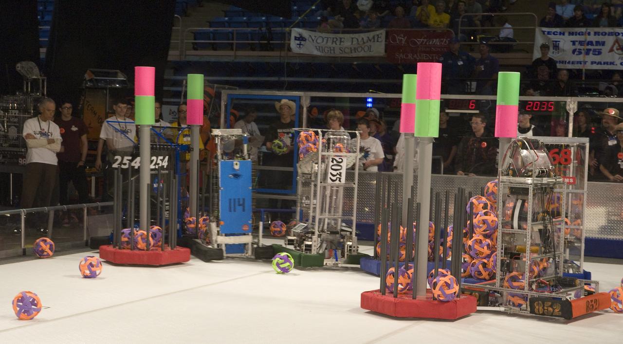 FIRST Robotics Competition 'Lunacy' hosted by NASA at San Jose State University Event Center. For Inspiration and Recognition of Science and Technology let the games begin. NASA Cheesy Poofs team #254, 'Rockin' Bots team #2035 and Eagle Strike team #114