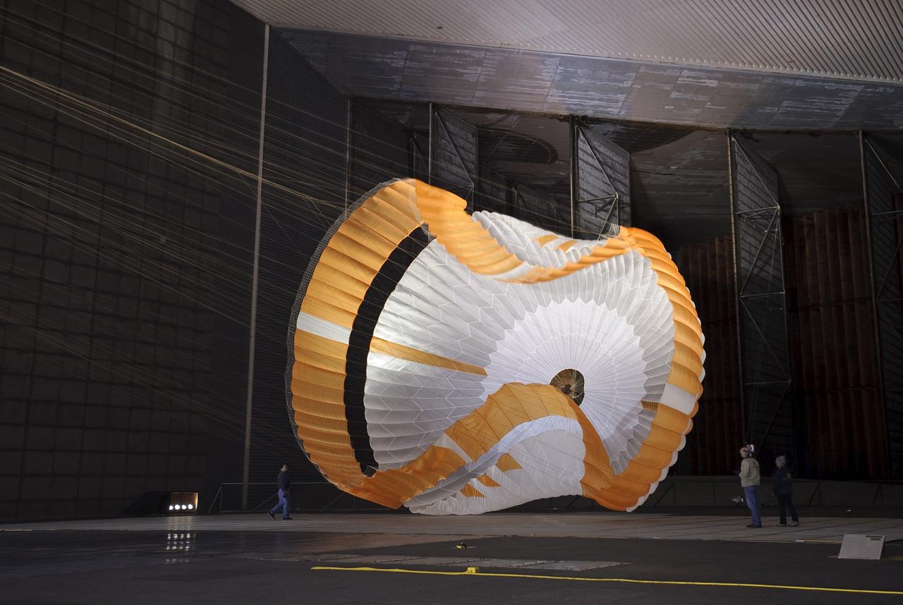 Mars Science Laboratory (MSL) parachuste test in the NASA Ames 80x120ft Subsonic Wind Tunnel at Moffett Field, Calif. (TR #22 - Phase 6) is the largest ever built to fly on an extraterrestrail mission. This image shows the qualification-test parachute beginning to open a few seconds after it was launched from a mortar into an 80-mile-per-hour (36-meter-per-second) wind.