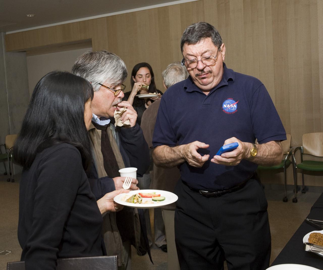 Yuri's Night 2009 held at the California Acaemy of Sciences in San Francisco, California Ames volunteer David Morse with Mike Mewhinney and wife also of Ames.