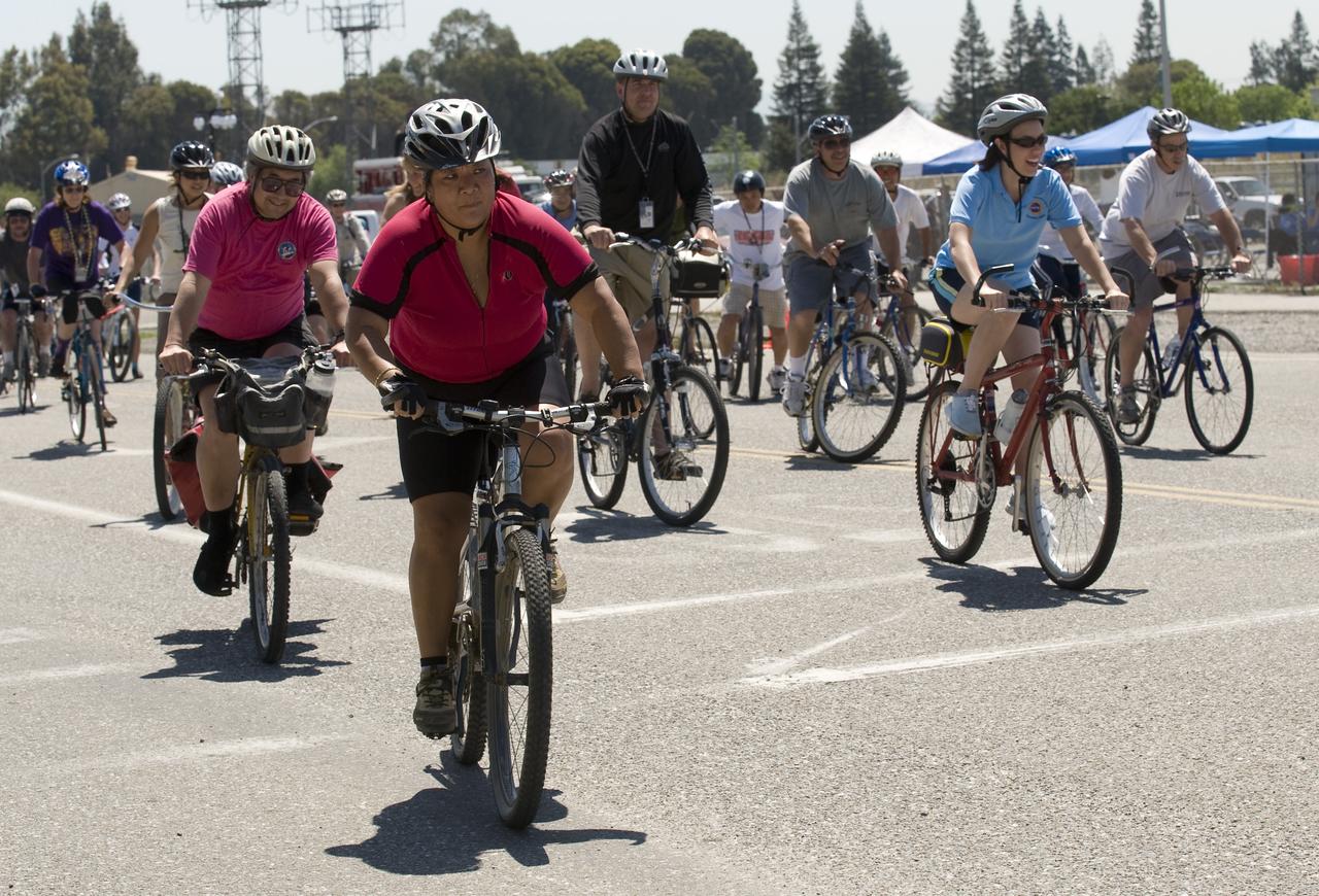 Tour DE Ames Bicycle event (start at Macon Road Gate - ending a the Old Mimi Mart on R.T. Jones Road)  Deb Feng, Chief Center Operations (acting), starts off the race with fellow bikers on the first Tour de Ames