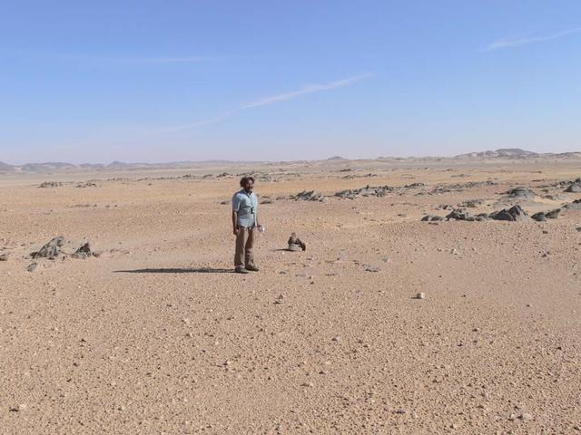 An SUV-sized Asteroid 2008TC# Impacts on October 7, 2008 in the Nubian Desert, Northern Sudan: Dr. Peter Jenniskens, NASA/SETI joined Muawia Shaddas of the University of Khartoum in leading an expedition on a search for samples. (Dr Mauwia Shaddad) Photo Credit: NASA/SETI/P. Jenniskens