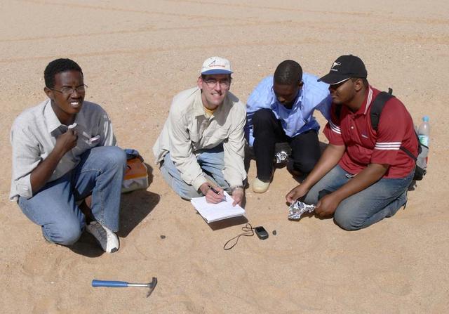 An SUV-sized Asteroid 2008TC# Impacts on October 7, 2008 in the Nubian Desert, Northern Sudan: Dr. Peter Jenniskens, NASA/SETI joined Muawia Shaddas of the University of Khartoum in leading an expedition on a search for samples. (find #11 & 12) Photo Credit: NASA/SETI/P. Jenniskens