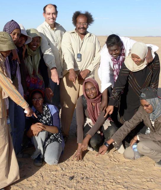 An SUV-sized Asteroid 2008TC# Impacts on October 7, 2008 in the Nubian Desert, Northern Sudan: Dr. Peter Jenniskens, NASA/SETI joined Muawia Shaddas of the University of Khartoum in leading an expedition on a search for samples. (find # 1) Photo Credit: NASA/SETI/P. Jenniskens