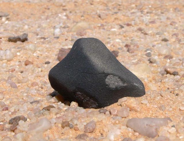 An SUV-sized Asteroid 2008TC# Impacts on October 7, 2008 in the Nubian Desert, Northern Sudan: Dr. Peter Jenniskens, NASA/SETI joined Muawia Shaddas of the University of Khartoum in leading an expedition on a search for samples.  (meteorite 3rd-geologist)  Photo Credit: NASA/SETI/P. Jenniskens