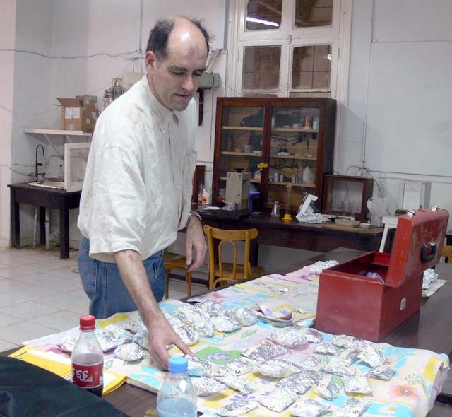 An SUV-sized Asteroid 2008TC# Impacts on October 7, 2008 in the Nubian Desert, Northern Sudan: Dr. Peter Jenniskens, NASA/SETI joined Muawia Shaddas of the University of Khartoum in leading an expedition on a search for samples. Peter Jenniskens examines 2nd trip finds) Photo Credit: NASA/SETI/P. Jenniskens