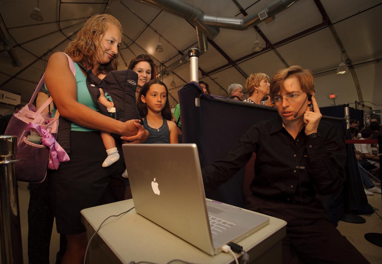 LCROSS launch public viewing event held at Ames Research Center, Moffett Field, CA   Dr. Kimberly Ennico, LCROSS mission scientist is shown here monitoring the launch squence. .