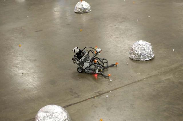 International Space University (ISU - 2009) students participated in a Robotic Competition at NASA'A Ames Research Center, Moffett Field, Calif. This panel featured astronauts from four different space agencies with different areas of expertice and diverse perspectives. A student-built robot rolls across the obstacle course.