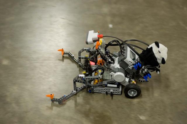 International Space University (ISU - 2009) students participated in a Robotic Competition at NASA'A Ames Research Center, Moffett Field, Calif. This panel featured astronauts from four different space agencies with different areas of expertice and diverse perspectives. A student-built robot rolls across the obstacle course.