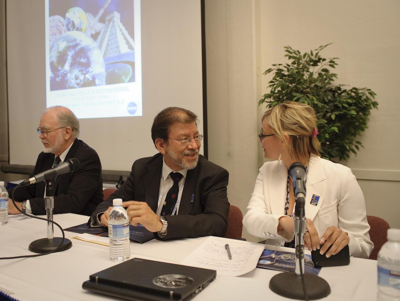 International Space University (ISU) and Singularity University (SU) Emerging Space Nations Panel held at NASA's Ames Research Center 2009 host site. (From let to right) The panel moderator, Ray Williamson, ISU SSP09 distinguished lecturer and exectuive director of the Secure World Foundation and panelsists Sergio Camacho, secretary genreal, Regional Center for Space Science and Tecnology Education fo rLatin America and the Caribbean, and Nicole Jordan, associate liaison for space prizes for the X Prize Foundation, Playa Vista, Calif., prepare before the discussion begins.