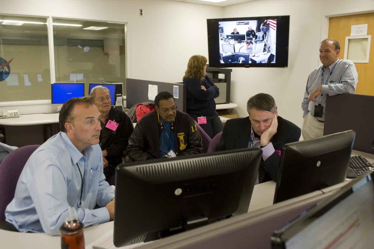 LCROSS Impact Night: In the Mission Operations Control Room (MOCR). From left to right, John Marmie, Jack Boyd, Lew Braxton, Pete Worden, Tina Panontin (looking at wall monitor) and Chuck Duff awaiting confirmation of impact