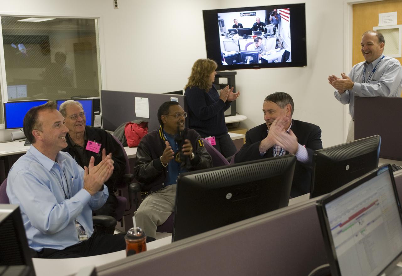 LCROSS Impact Night: From left to right John Marmie, Jack Boyd, Lewis Braxton, III,  Tina Panontin, Pete Worden (center front) Chuck Duff, in the Mission Operations Control Room (MOCR).  All right, impact!