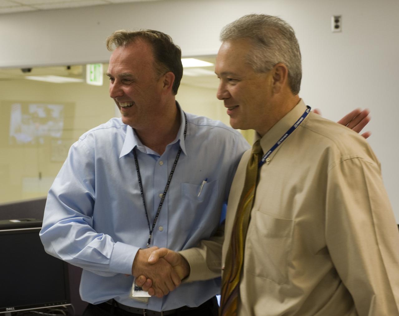 LCROSS Impact Night: John Marmie (on left) and Peter Klupar (on right) In the Mission Operations Control Room (MOCR) at NASA Ames Research Center, Moffett Field, Calif. just after impact.