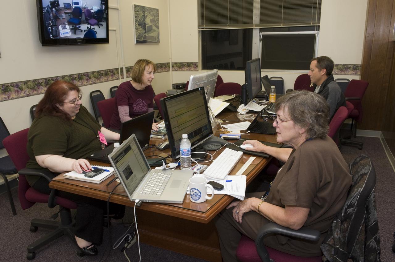 LCROSS Impact Night from left to right operating the NASA Ames Public Affairs Office media room are Wendy Stincele, Cathy Weselby, Jerry Colen, and Linda Conrad.