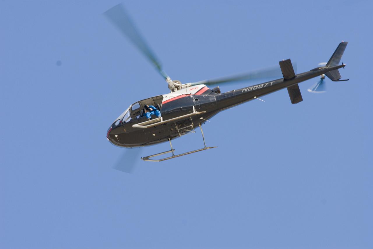 Ames 70_year picture day on Flight line.  Eric James in helicopter taking the aerial view of the 70.