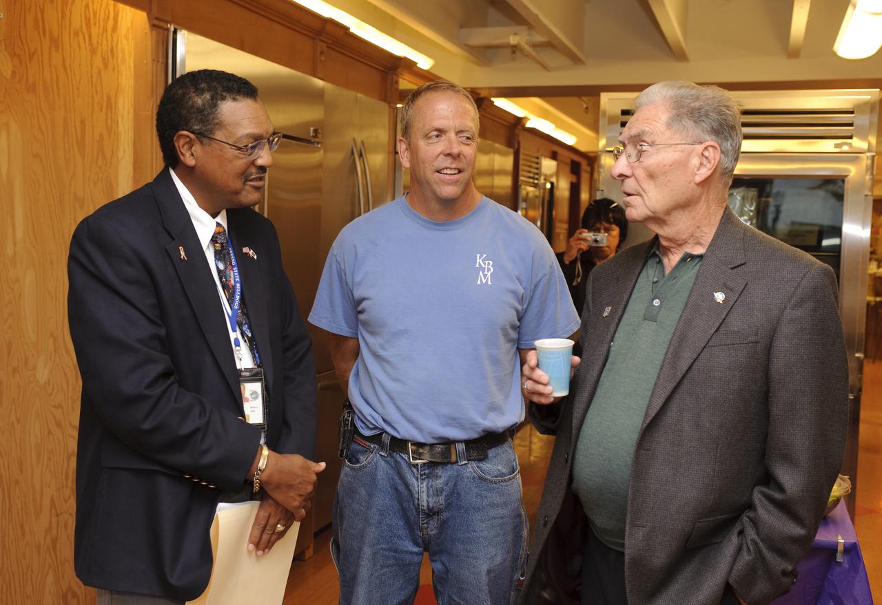 Ames 70 Year Anniversary Exhibit in downtown Mountain View, California. Grand Opening at Meyer Appliance, Castro Street. Left to right Lewis Braxton III, Ames Deputy Center Director, Mr Meyer III, and Jack Boyd, Ames awaiting the opening ceremony.