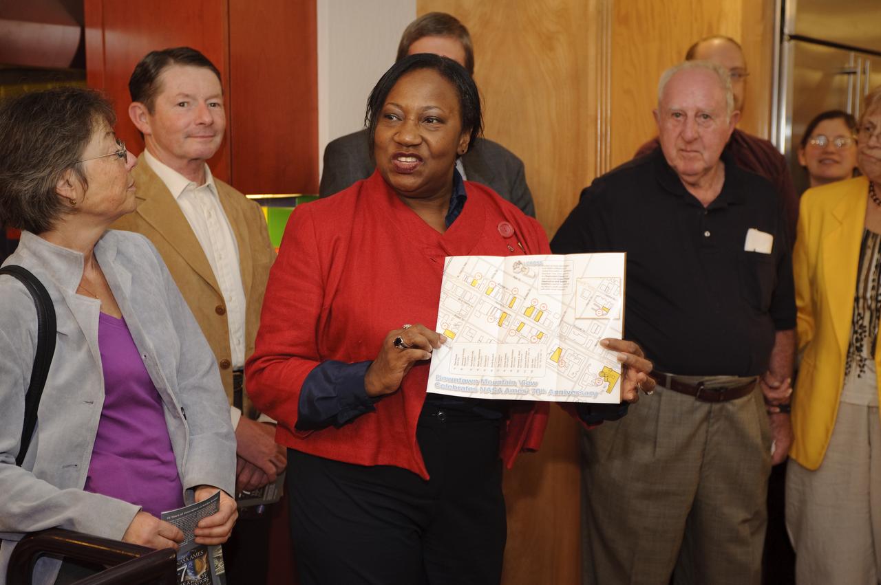 Ames 70 Year Anniversary Exhibit in downtown Mountain View, California. Grand Opening at Meyer Appliance, Castro Street. Shelia Johnson, Ames shows the exhibit tour map.