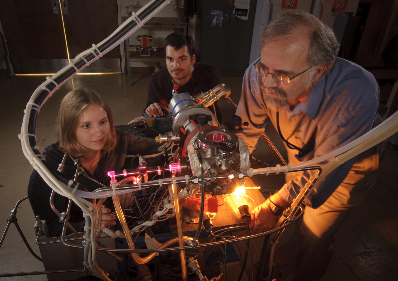 Stefanie Milam, Michel Nueva and Scott Sandford, in the Ames Astrochemistry Lab, N-245 for feature article on their uracil research. NASA Scientists studying the origin of life have reproduced uracil, a key component of our hereditary material in the laboratory.