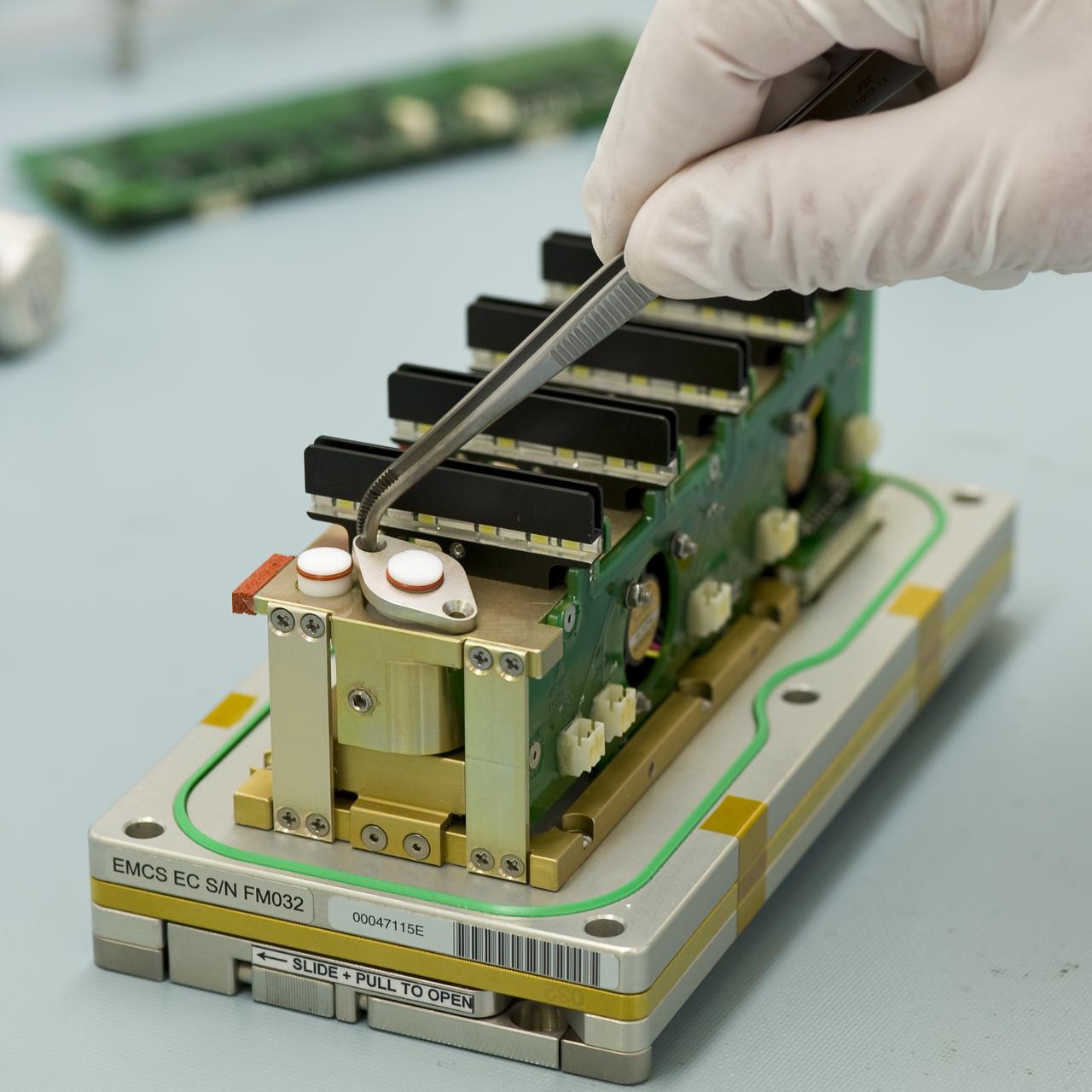 TROPI-2; Assembly of flight hardware with Prepared Experiment Containers loaded with seeds in EMCS (European Modular Cultivation System) Lab, N-236. Flight hardware will be hand carried to KSC for loading on STS-130 Shuttle mission