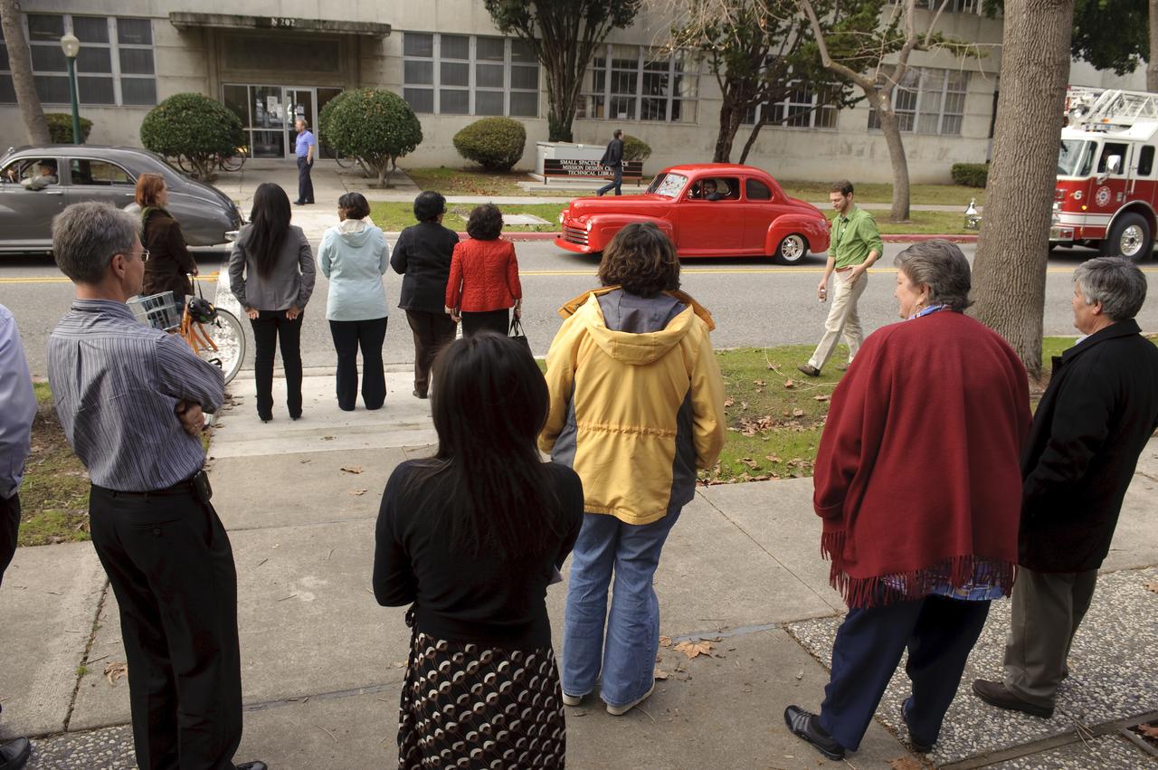 Ames 70th Anniversary Turn Back the Clock Day with antique Class Cars and Classic Car parade around the center.