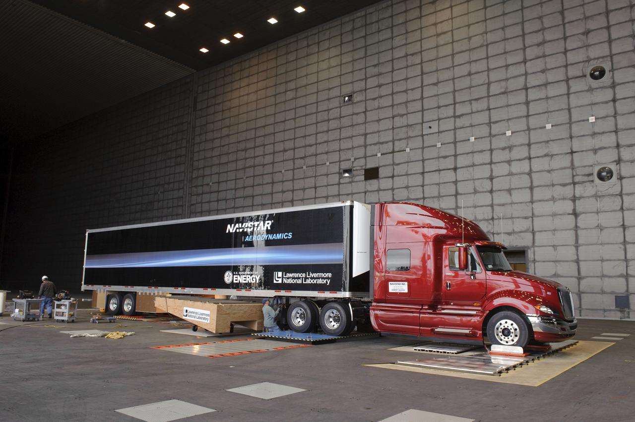 Lawrence Livermore National Labs (LLNL), Navistar and the Department of Energy conduct tests in the NASA Ames National Full-scale Aerodynamic Complex 80x120_foot wind tunnel. The LLNL project is aimed at aerodynamic truck and trailer devices that can reduce fuel consumption at highway speed by 10 percent. LLNL's test piece is being installed on truck.