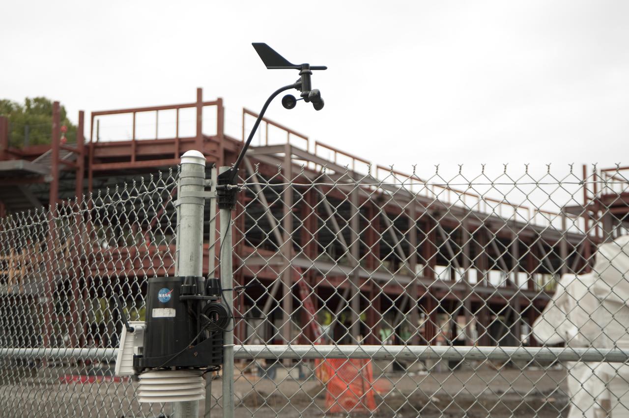 Construction of the new NASA Ames Green Building dubbed Sustainability Base located on the Ames Research Center campus at Moffett Field, CA.  Air sampler mounted on fence.