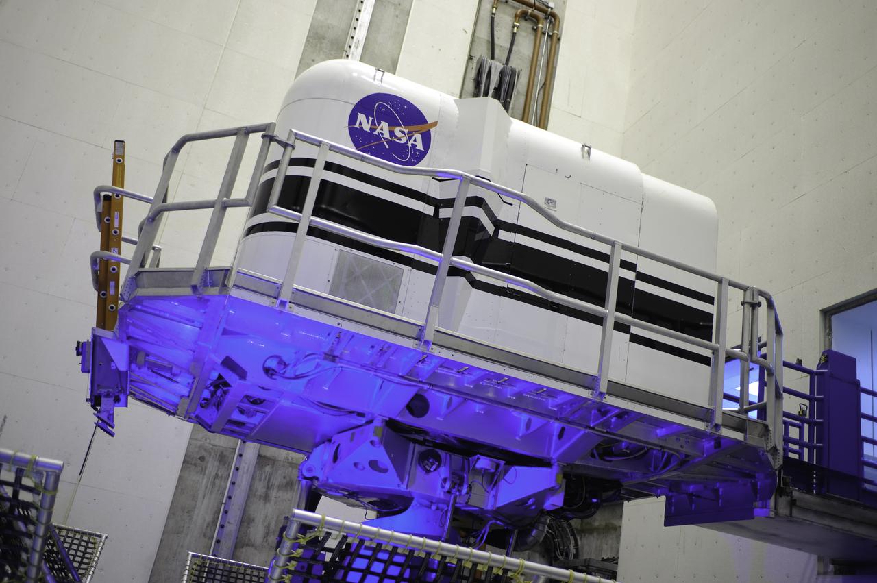 Vertical Motion Simulator (VMS) interior with Shuttle Cab (S-cab) mounted in facility.