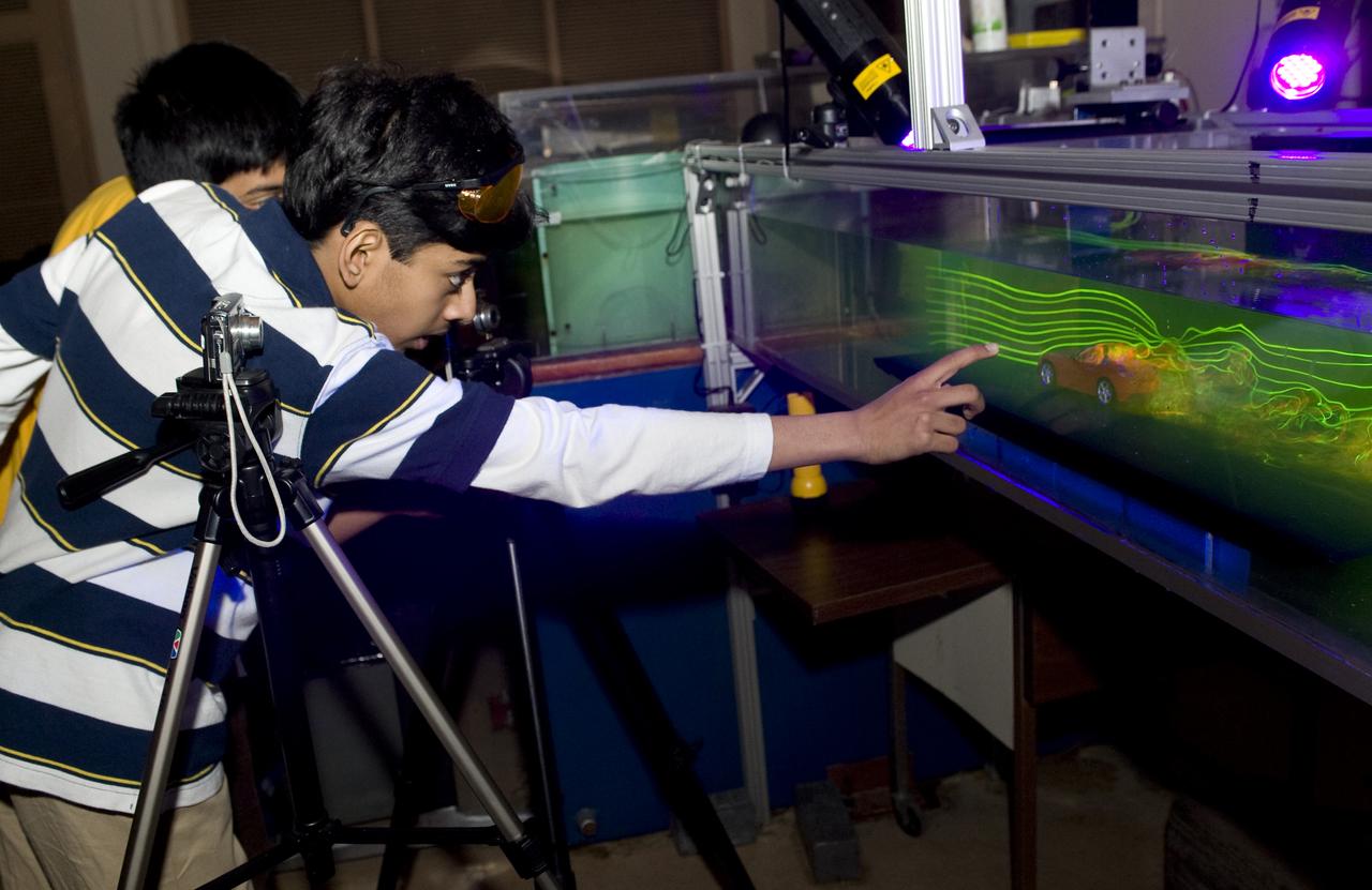 Students, Ajay Ramesh and Prithvi Aiyaswamy  in 7th grade, Chaboya Middle School, San Jose, have entered the Intel Inernational Science Fair (May 2010) They are here at the Ames Research center to test the drag of race cars in the Fluid Mechanics Lab (FML)