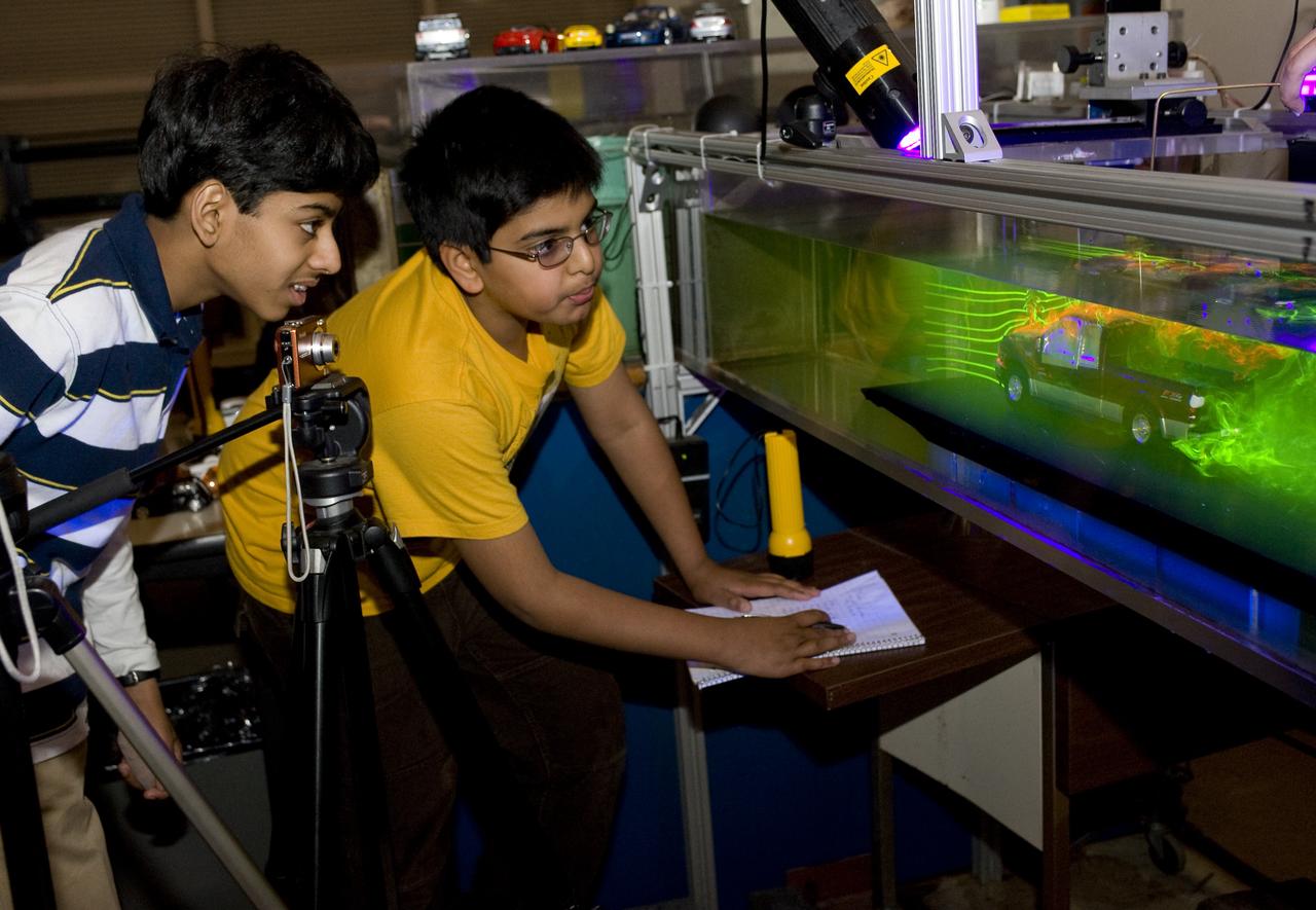 Students, Ajay Ramesh and Prithvi Aiyaswamy in 7th grade, Chaboya Middle School, San Jose, have entered the Intel Inernational Science Fair (May 2010) They are here at the Ames Research center to test the drag of race cars in the Fluid Mechanics Lab (FML)