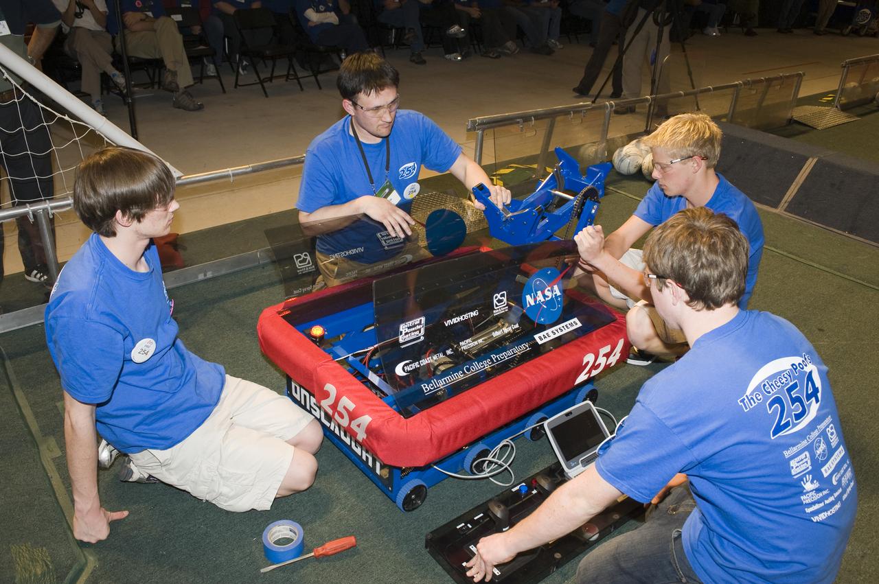 For Inspiration and Recognition of Science and Technology; FIRST Robotics Competition 2010 Silicon Valley Regional held at San Jose State University, San Jose, California Cheesy Poofs Team 254 on the floor making adjustments.