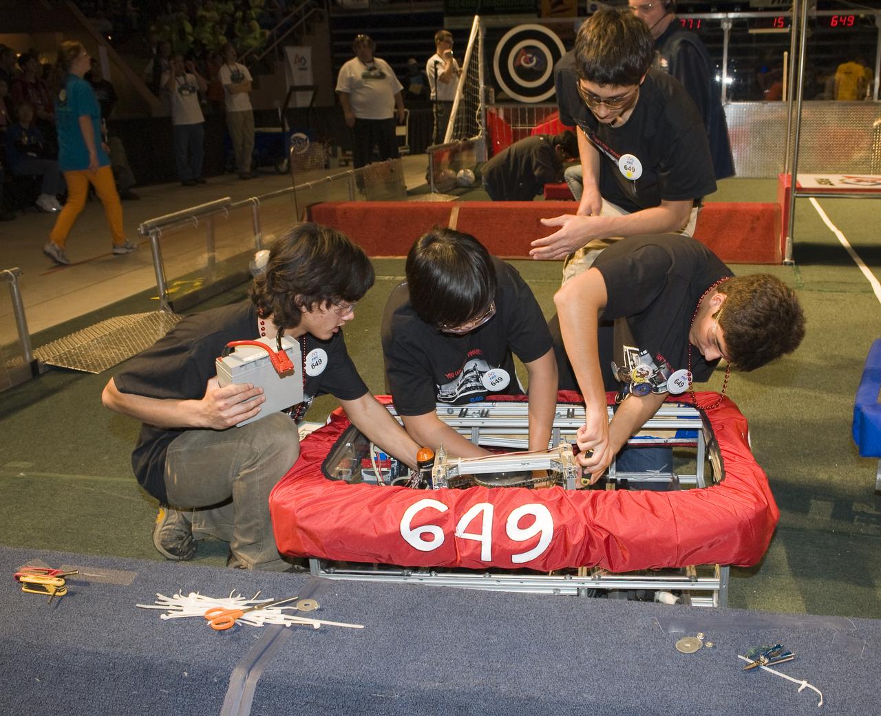 For Inspiration and Recognition of Science and Technology; FIRST Robotics Competition 2010 Silicon Valley Regional held at San Jose State University, San Jose, California NASA Sponsored MSET, Saratoga H.S. team 649 making adjustments in the pit area.