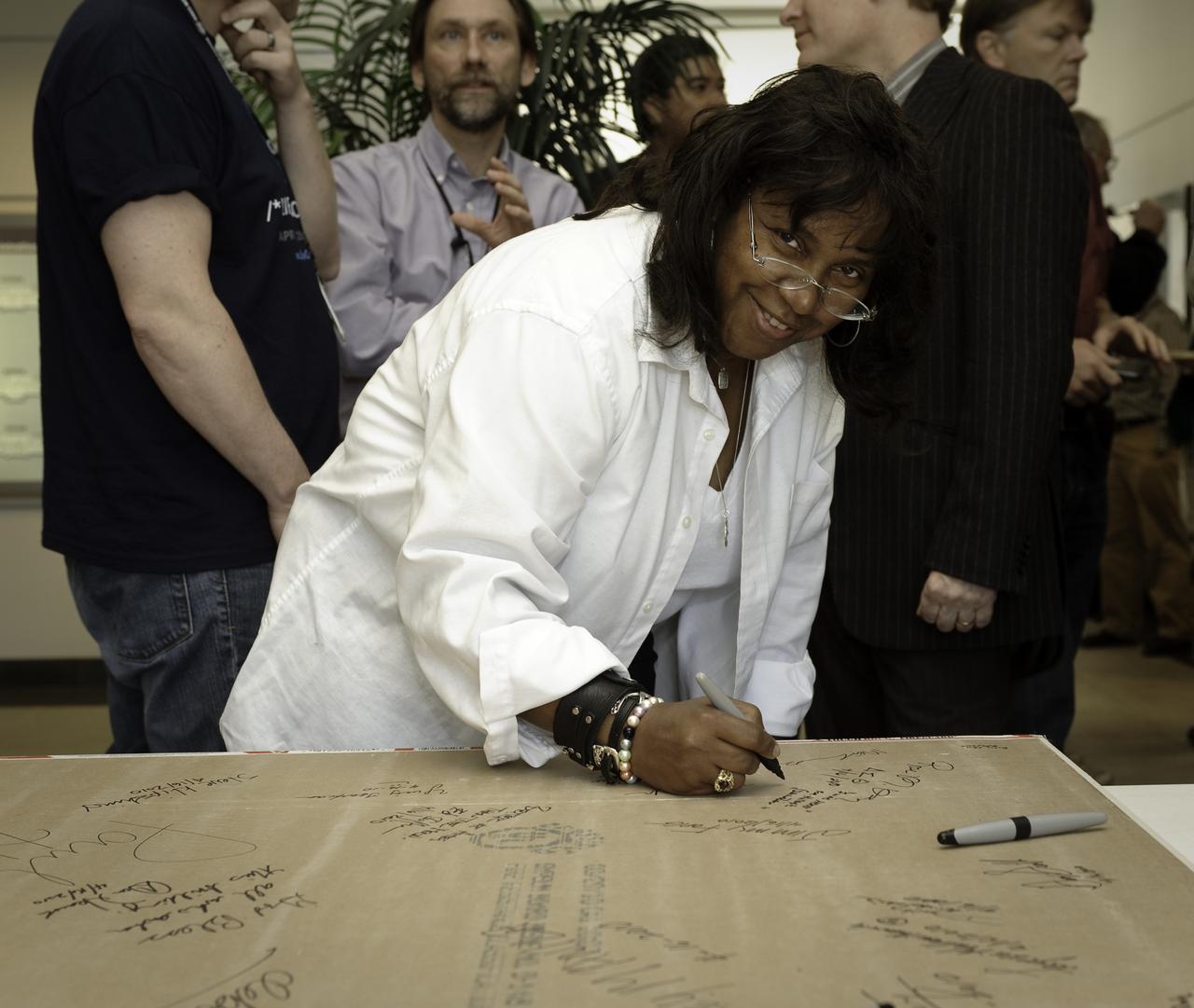 Sustainability Base celebration, sheetrock signing and social in lobby of N-200. Rose King of Code C slated to become on of the first occupants of the new Green building at NASA Ames Research Center, Moffett Field, California designated Sustainability Base N-232 puts her mark on the building forever.