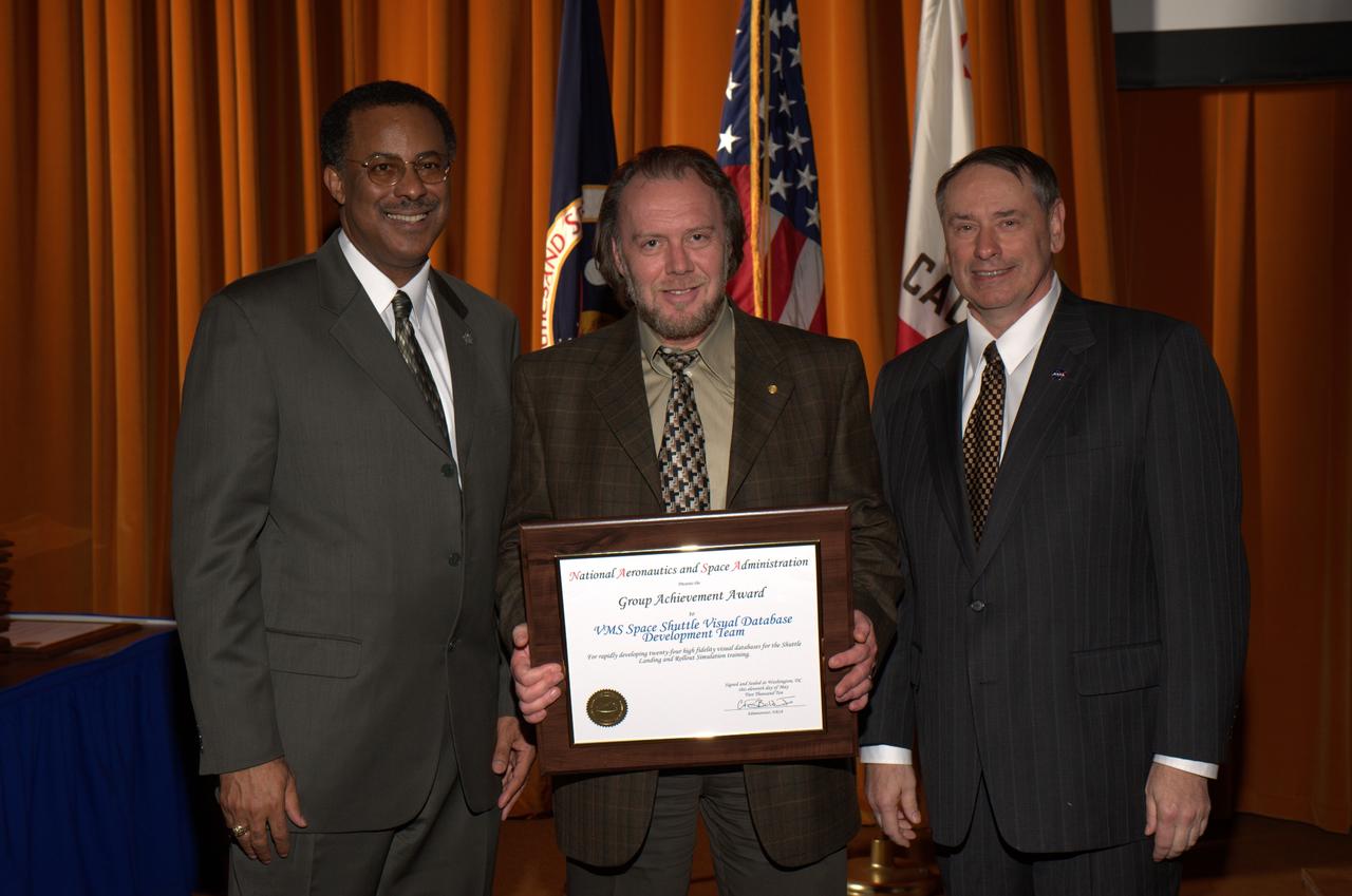 2010 NASA Honor Awards Awards Group Achievement Award to VMS Space Shuttle Visual Database Development Team. Boris M. Rabin accepting. Presenters are on left Mr. Charles H. Scales, NASA Associate Deputy Administrator, on right Dr. S. Pete Worden, Director, NASA Ames Research Center.