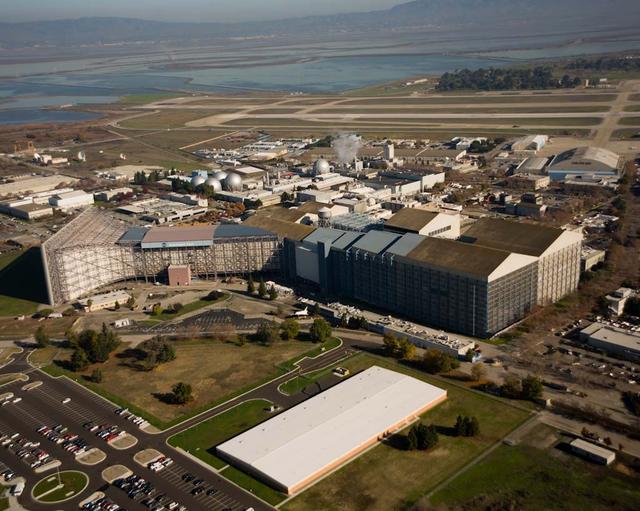 N-221 NASA Ames Research Center National Full-Scale Aerodynamic Complex NFAC (40x80x120) foot wind tunnel aerial with new Army Admin. building in foreground