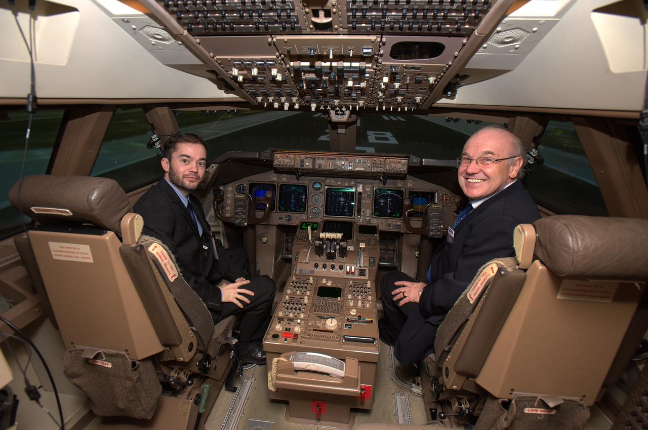German Deligation visits Ames SOFIA Science Office for briefing and enjoy a Ames tour of CVSRF Simulator and 'fly' in the 774 cab with l-r Dr. Falk Rouven Bomede and Hans Zinnecker
