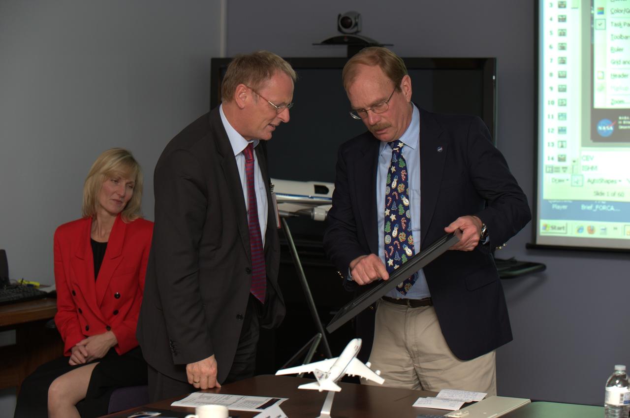 German Deligation visits Ames SOFIA Science Office for briefing and enjoy a Ames tour.  .Jochen Homann, Sectretary of State, Federal Ministry of Economics and Technology, speaks with Robert R. 'Bob' Meyer, NASA SOFIA Program Manager (based at the Dryden Aircraft Operations Facility, DAOF, Palmdale, California).