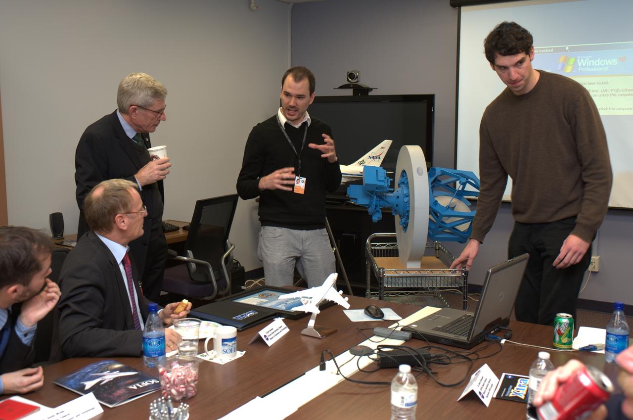 German Deligation visits Ames SOFIA Science Office for briefing. Left to right  Jochen Homann, German State Secretary Federal Ministry of Economics and Technology, Dr. Benno Bunse, President & CEO, German American Chamber of Commerce, New York, Manuel Wiedemann, post-doctorate student from the Deutsches SOFIA Institute, University of Stuttgart.