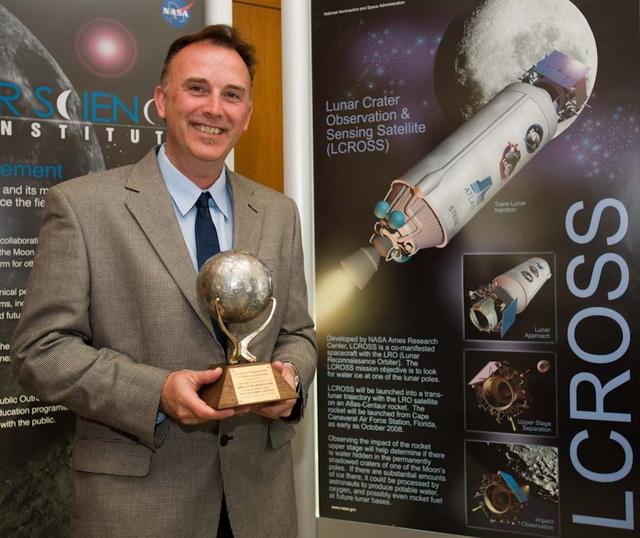 John Marmie, deputy project manager of the Lunar CRater Observation and Sensing Satellite Mission with the 2010 National Space Society Space Pioneer Award, which he accepted on behalf of the NASA Ames LCROSS mission team.