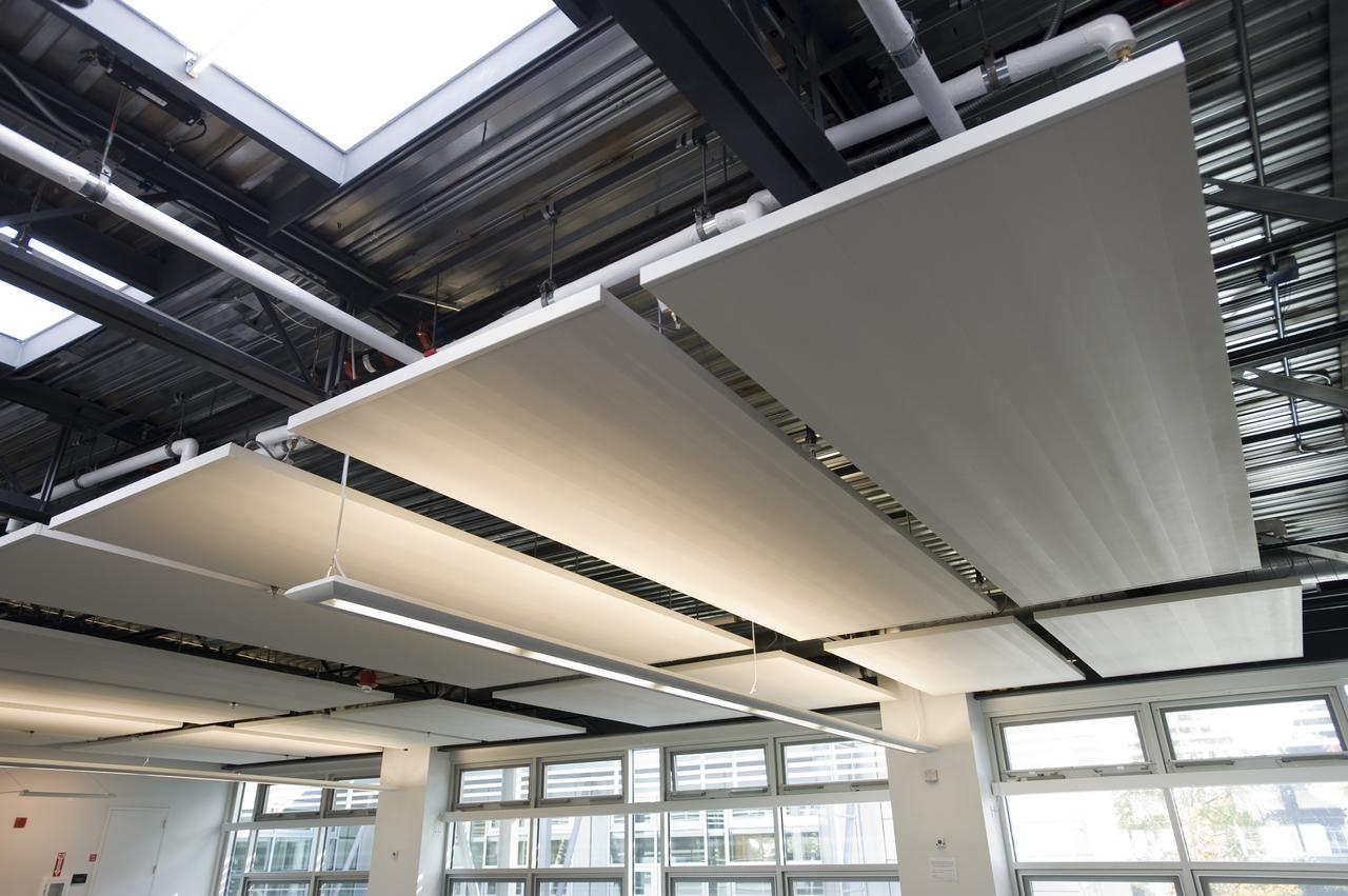 Construction of the new NASA Ames Green Building dubbed Sustainability Base located on the Ames Research Center campus at Moffett Field, CA. interior view as cubicles are being set up and open spaces arranged. artifical lighting, skylights and windows