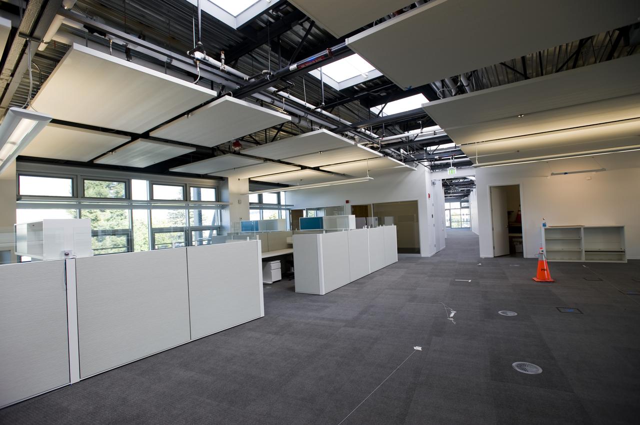 Construction of the new NASA Ames Green Building dubbed Sustainability Base located on the Ames Research Center campus at Moffett Field, CA. interior view as cubicles are being set up and open spaces arranged.