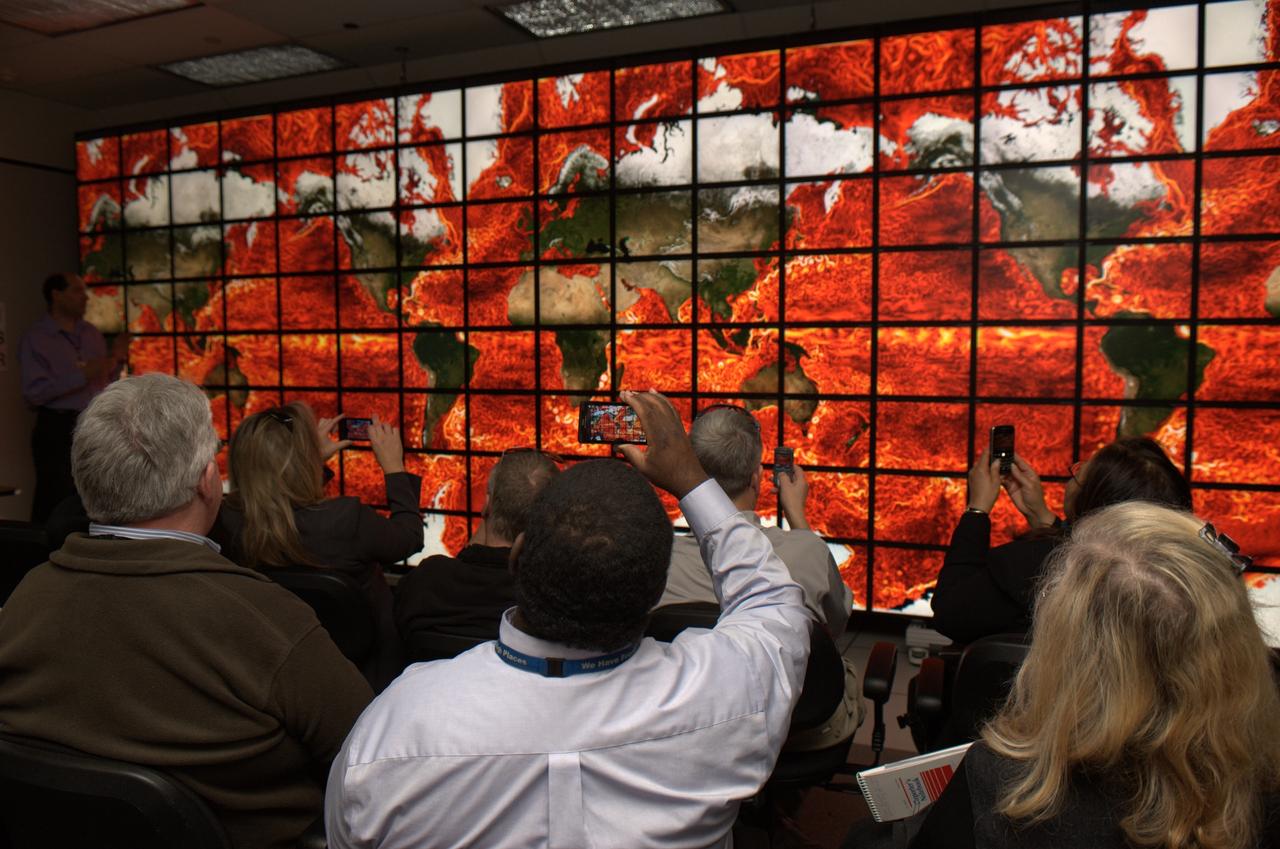 NAS Facility Hyperwall 2 visit and tour: HQ Review Committee on Facility & Real Property. Showing on Hyperwall Ocean current temperatures.