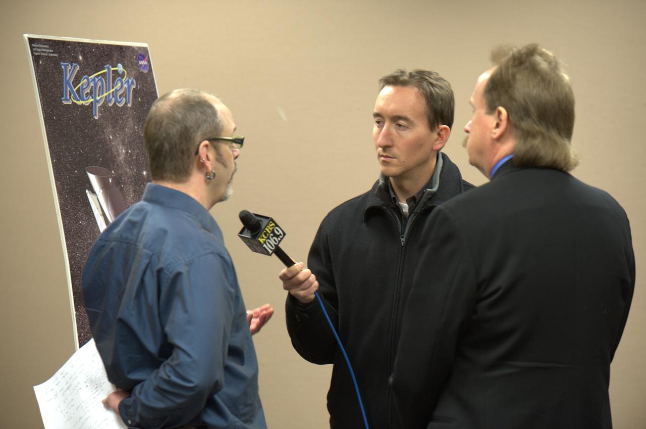Kepler team members at press event and doing media interviews.