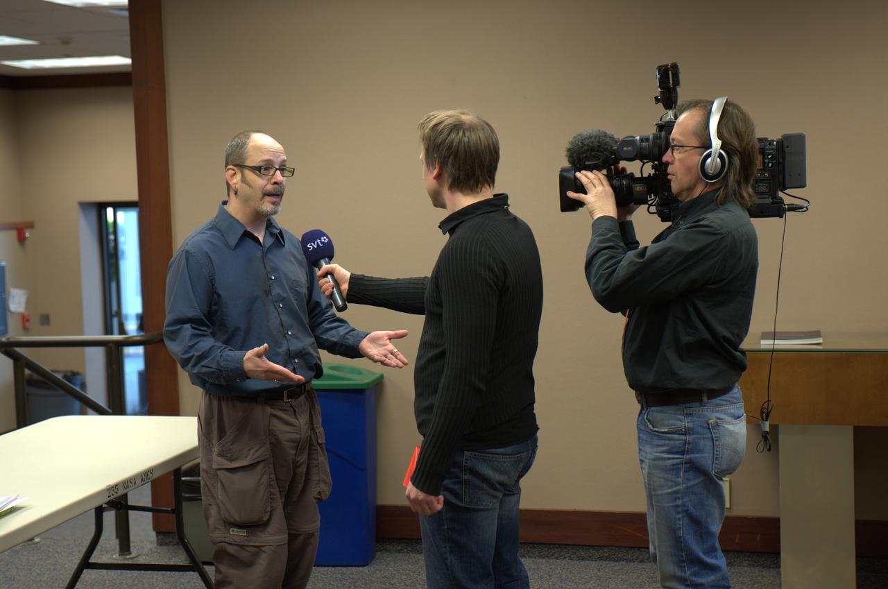 Kepler team members at press event and doing media interviews.