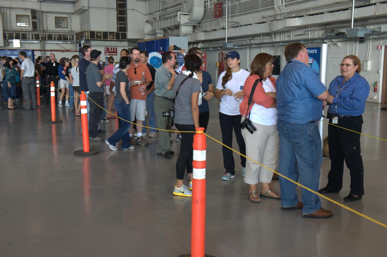 SOFIA visits Ames Research Center for public outreach tours by Ames staff, family and friends. Mina Cappuccio, project manager briefs the visitors waiting their turn in line.